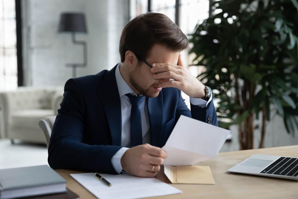 Businessman dealing with debts