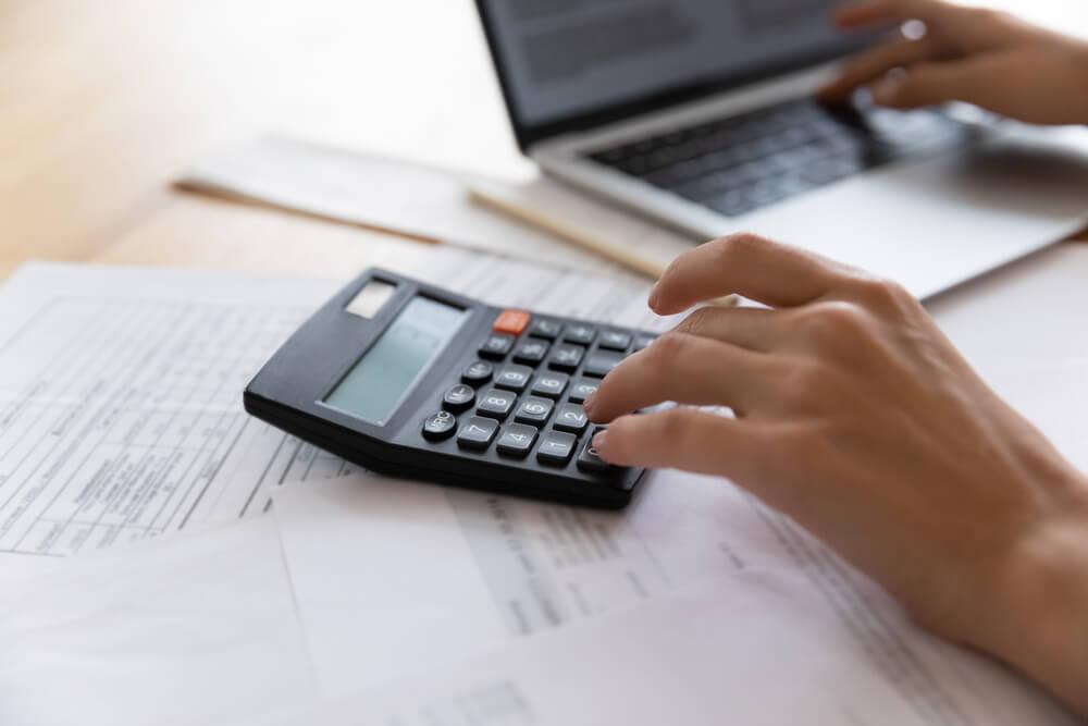 Business woman on a calculator